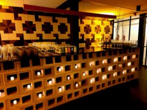 Wet bar set with drinks and hors d’oeuvres in the Alloy on 5th Lounge area, perfect for cocktail hours and receptions.